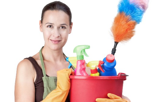 Professional steam carpet cleaning equipment cleaning a living room carpet